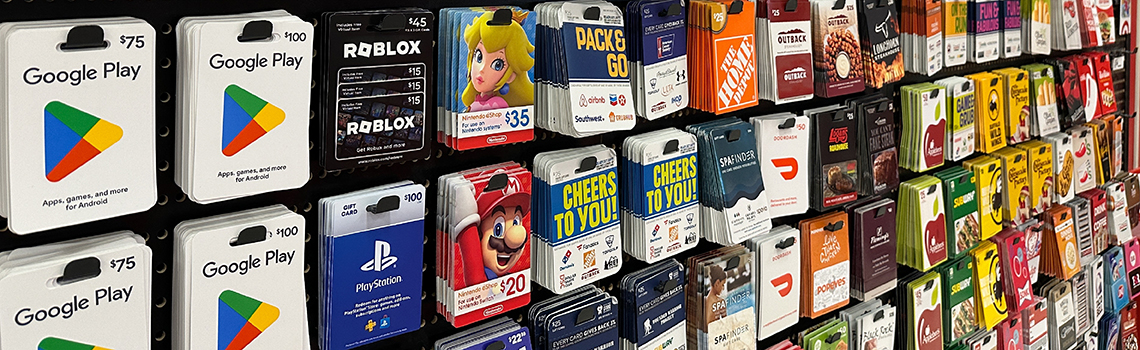 A display of various gift cards in a retail store